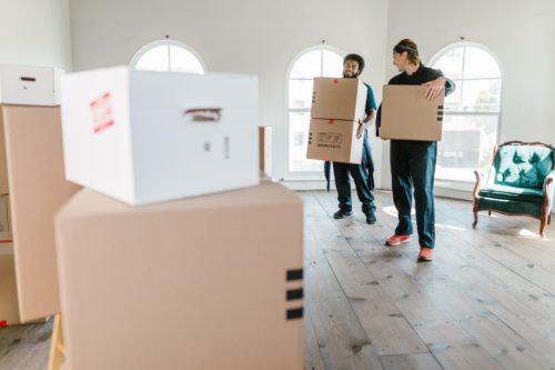Movers with boxes in their hands
