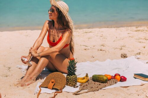 A woman enjoying a picnic at one of Miami’s hidden beaches.
