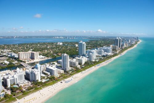 An aerial photo of the beach and the buildings in Miami